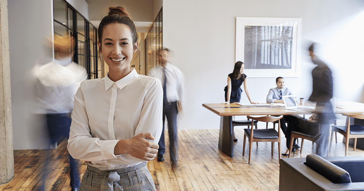 Smiling lady looking at camera in office